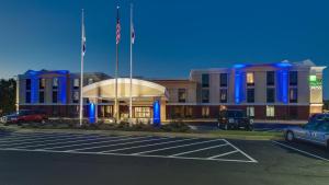 a building with a parking lot in front of it at Holiday Inn Express Hotel & Suites Midlothian Turnpike, an IHG Hotel in Richmond