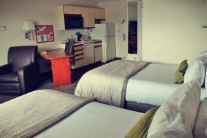 A bed or beds in a room at Candlewood Suites Syracuse-Airport, an IHG Hotel
