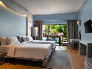 Кровать или кровати в номере Aonang Villa Resort I Beach Front