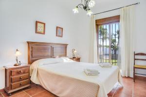 Кровать или кровати в номере Casa Villanueva 3 Sólo Familias +18 фотографий