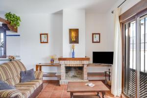 Телевизор и/или развлекательный центр в Casa Villanueva 3 Sólo Familias