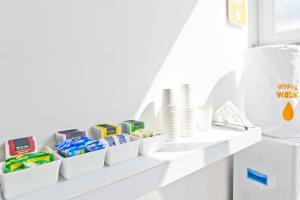 a white shelf with dishes and toys on it at X by Bloom I Hebbal Manyata Park in Bangalore