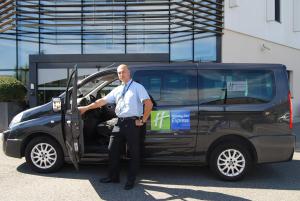 a police officer standing in front of a van at Holiday Inn Express Toulouse Airport, an IHG Hotel in Blagnac