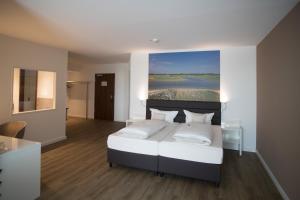 Postel nebo postele na pokoji v ubytování Hotel absolute