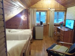 TV a/nebo společenská místnost v ubytování White Villa
