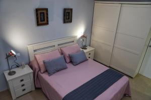 Ein Bett oder Betten in einem Zimmer der Unterkunft El Balcon