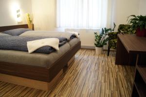 Posteľ alebo postele v izbe v ubytovaní Penzion Ranch