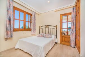 Ein Bett oder Betten in einem Zimmer der Unterkunft Vistamar 5A - Puerto de Alcudia