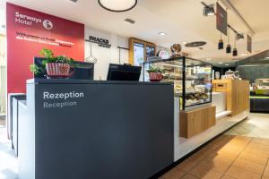 a bakery counter with a reputation reception at Serways Hotel Reinhardshain Nord in Grünberg