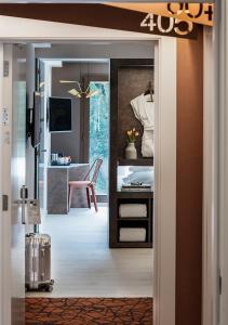 a door leading into a room with a bedroom at Axel Hotel San Sebastián - Adults Only in Donostia-San Sebastián