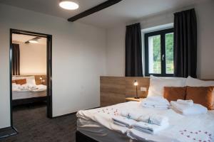 Voodi või voodid majutusasutuse Resort Orsino toas