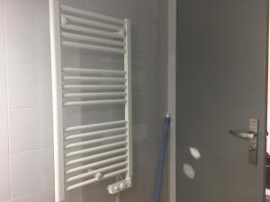 a glass shelf in a shower in a bathroom at Calvi au soleil in Calvi