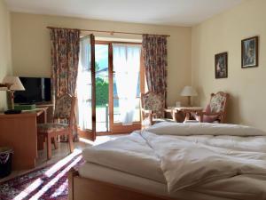 Postel nebo postele na pokoji v ubytování DEVA Achentaler Vitalhotel