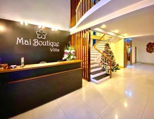 a restaurant with a sign that reads mat boathouse village at Mai Boutique Villa in Da Nang