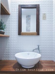 a bathroom with a white sink and a mirror at Otium Boutique Room in Pai +22 photos