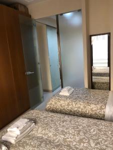 A bed or beds in a room at Visconti apartment.