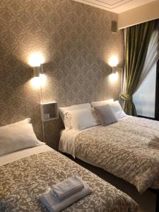A bed or beds in a room at Visconti apartment.