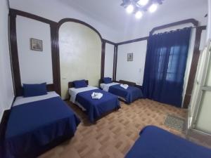 A bed or beds in a room at Cecilia Hostel