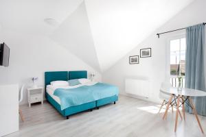 Łóżko lub łóżka w pokoju w obiekcie Apartamenty Góra