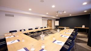 a conference room with a long table and chairs at Holiday Inn Express - Saarbrücken by IHG in Saarbrücken