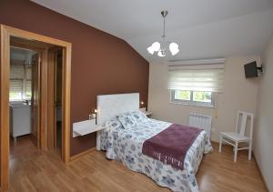 Кровать или кровати в номере Pensión Casa Elena