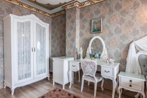 a bedroom with a dressing table and a mirror at Romantic Hotel Istanbul in Istanbul