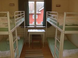 Palanda nebo palandy na pokoji v ubytování Dala-Järna Hotell och Vandrarhem
