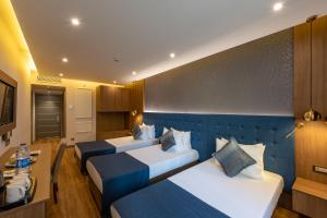 מיטה או מיטות בחדר ב-Nova Plaza Crystal Hotel & Spa