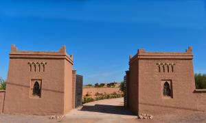 an entrance to a brick building with two towers at DOMAINE VILLA PRIVE in Marrakesh
