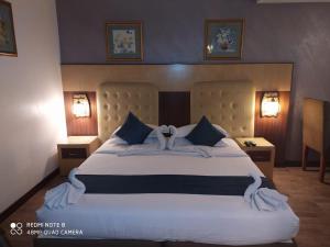 Postel nebo postele na pokoji v ubytování Hotel Silicrest