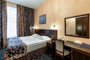 Łóżko lub łóżka w pokoju w obiekcie Sapphire Hotel