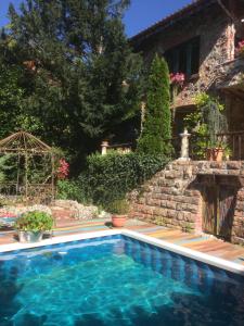 a swimming pool in front of a house at Casa toscana in Thun
