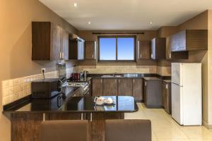 Kuchyň nebo kuchyňský kout v ubytování Tagore Apartments