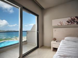 
a hotel room with a view of the ocean at Ionian Hill Hotel in Argassi
