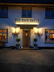 a building with a sign that reads the five bells hotel house at The Cavendish Five Bells in Cavendish