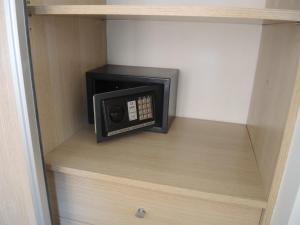 a small microwave in a shelf in a closet at Apartamento Casco Histórico in San Carlos de Bariloche