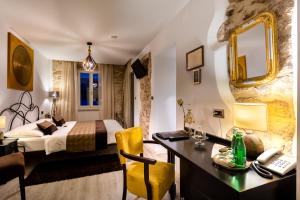 Postel nebo postele na pokoji v ubytování Hotel Heritage Forza