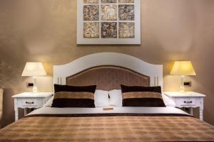 Postel nebo postele na pokoji v ubytování Hotel Heritage Forza