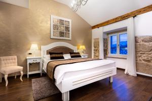 Postel nebo postele na pokoji v ubytování Hotel Heritage Forza
