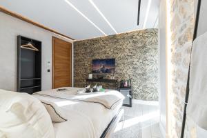 Säng eller sängar i ett rum på Le Dortoir Boutique Suites