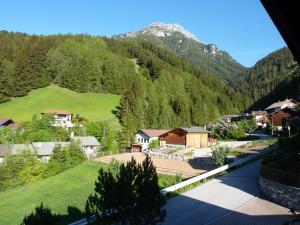 a view of a village in the mountains at Haus Früh in Telfes im Stubai