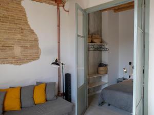 a living room with a couch and a bed at Luxury Apartment Stancesvic in Vic