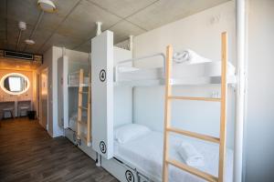 a bedroom with a bed and a window at Anda Venice Hostel in Mestre