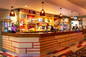 a bar with a large wooden counter top at Camping Pods, Dovercourt Holiday Park in Harwich