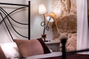 Postel nebo postele na pokoji v ubytování Hotel Heritage Forza