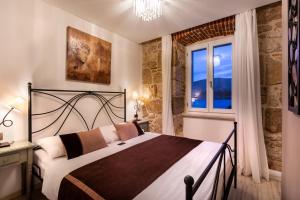 Postel nebo postele na pokoji v ubytování Hotel Heritage Forza