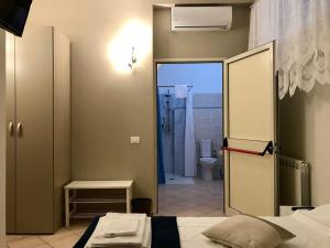 Postel nebo postele na pokoji v ubytování B&B Luminari