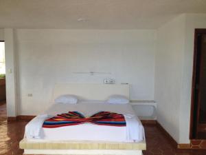 A bed or beds in a room at Safari Inn