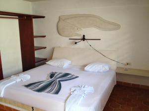 מיטה או מיטות בחדר ב-Safari Inn