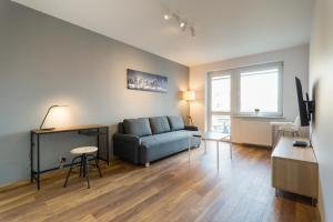 Televízia a/alebo spoločenská miestnosť v ubytovaní Wodna Street Big Family Apartment
